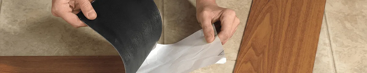 A professional installing vinyl flooring in Wichita, KS